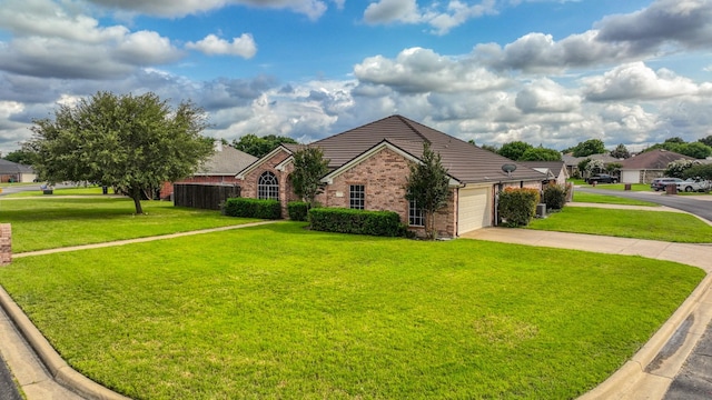 229 Willow Creek Dr, Weatherford, TX 76085 - view of front facade featuring brick siding, driveway, a front yard, and an attached garage
