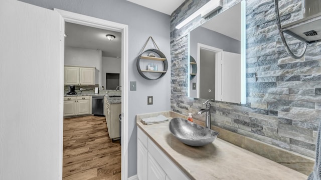 229 Willow Creek Dr, Weatherford, TX 76085 - full bath with decorative backsplash, vanity, and wood finished floors