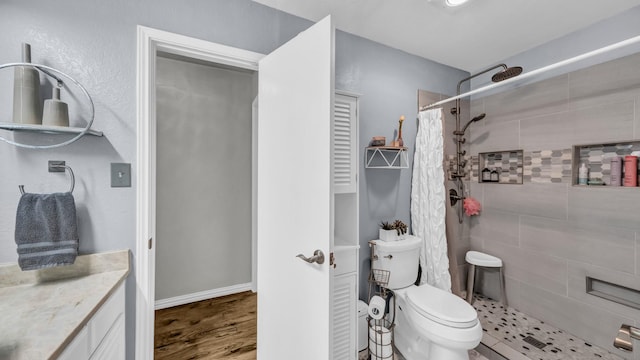 229 Willow Creek Dr, Weatherford, TX 76085 - full bathroom with tiled shower, toilet, vanity, and wood finished floors