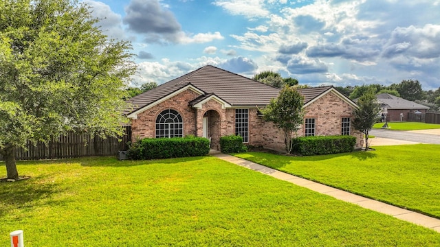 229 Willow Creek Dr, Weatherford, TX 76085 - view of front of house featuring brick siding and a tiled roof