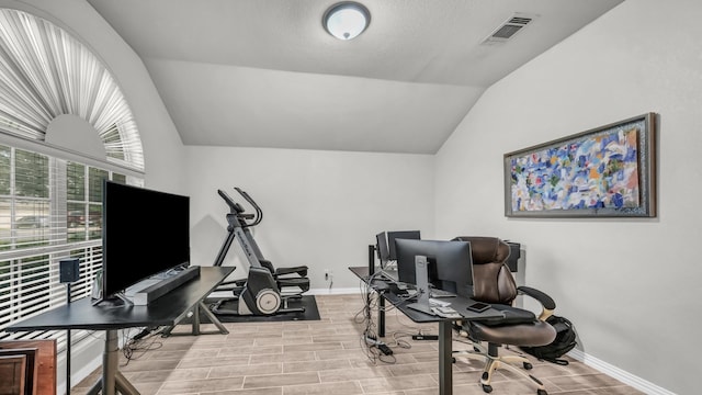229 Willow Creek Dr, Weatherford, TX 76085 - exercise area with vaulted ceiling, wood tiled floors, and baseboards
