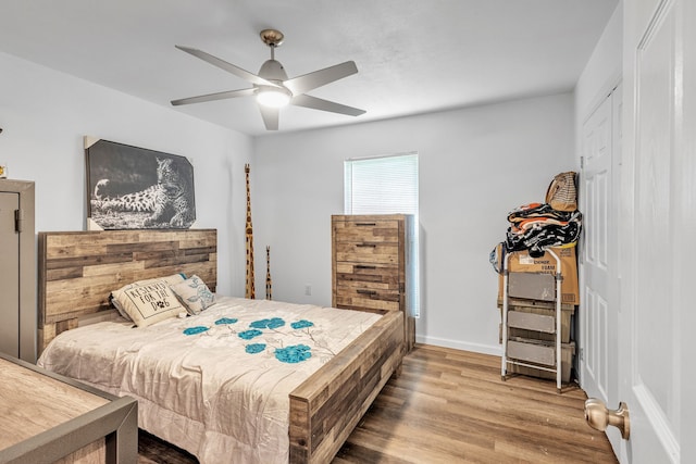 201 E Pearl St, Celeste, TX 75423 - bedroom featuring wood finished floors, a ceiling fan, baseboards, and a closet