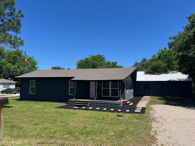 201 E Pearl St, Celeste, TX 75423 - ranch-style house featuring a front lawn, roof with shingles, and covered porch