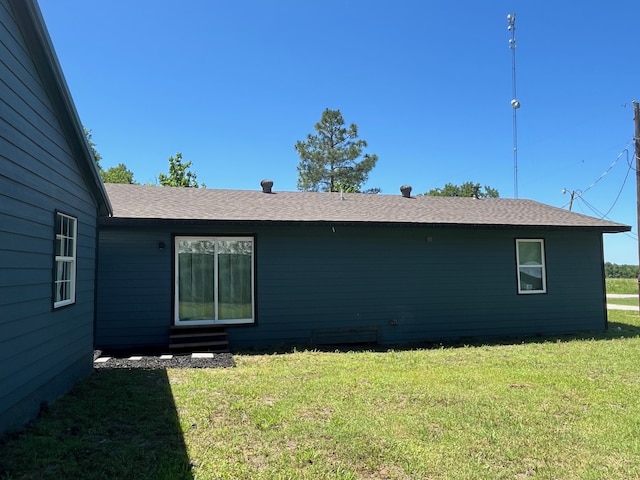 201 E Pearl St, Celeste, TX 75423 - rear view of property featuring a yard, entry steps, and roof with shingles