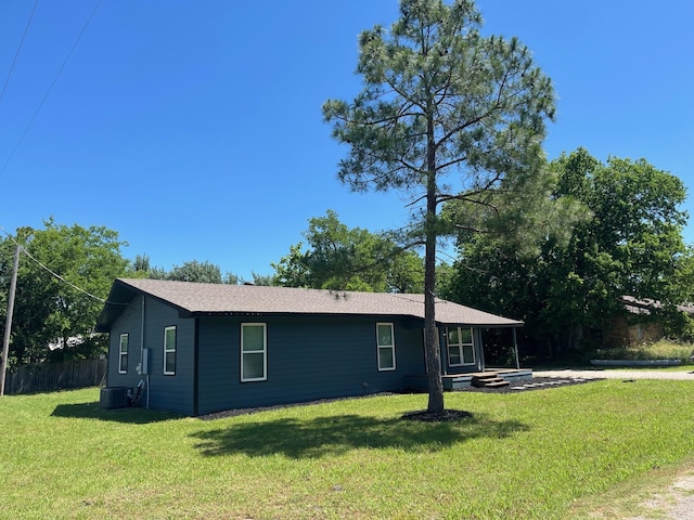 201 E Pearl St, Celeste, TX 75423 - view of side of home with a lawn and central AC unit
