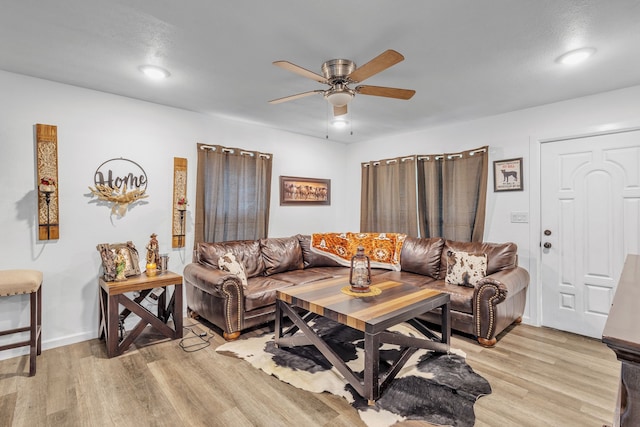 201 E Pearl St, Celeste, TX 75423 - living area featuring ceiling fan, light wood-type flooring, and baseboards