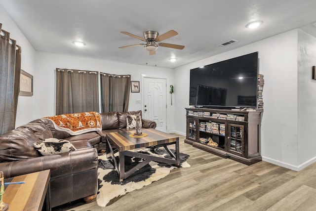 201 E Pearl St, Celeste, TX 75423 - living room with light wood-type flooring, a ceiling fan, and baseboards
