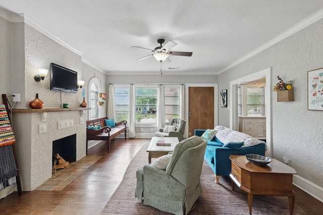 1425 W Gambrell St, Fort Worth, TX 76115 - living room featuring ceiling fan, wood finished floors, crown molding, a textured wall, and a fireplace with flush hearth