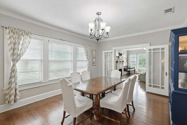 1425 W Gambrell St, Fort Worth, TX 76115 - dining area with a chandelier, hardwood / wood-style flooring, baseboards, and crown molding