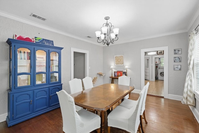 1425 W Gambrell St, Fort Worth, TX 76115 - dining space with a chandelier, dark wood-style floors, washer / clothes dryer, ornamental molding, and baseboards