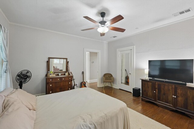 1425 W Gambrell St, Fort Worth, TX 76115 - bedroom with crown molding, dark wood-type flooring, and ceiling fan