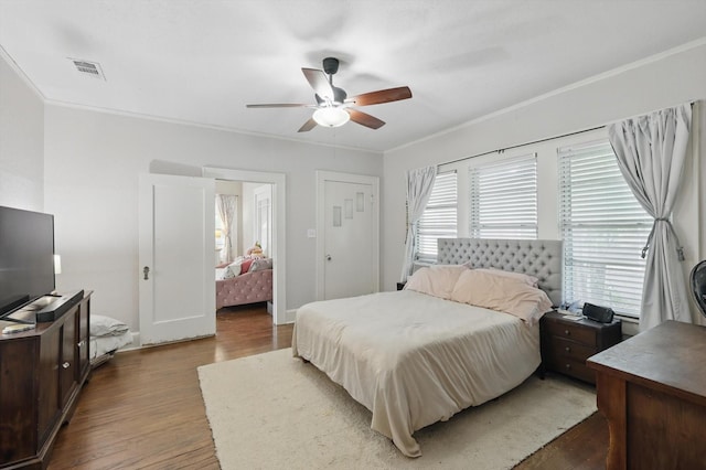 1425 W Gambrell St, Fort Worth, TX 76115 - bedroom with wood finished floors, ornamental molding, and ceiling fan