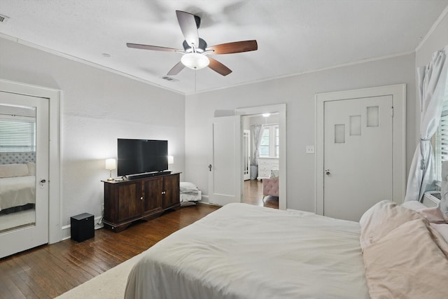 1425 W Gambrell St, Fort Worth, TX 76115 - bedroom with hardwood / wood-style floors, ornamental molding, a ceiling fan, and baseboards