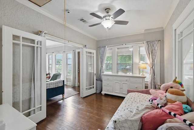 1425 W Gambrell St, Fort Worth, TX 76115 - bedroom with multiple windows, dark wood-style floors, crown molding, access to outside, and a textured ceiling