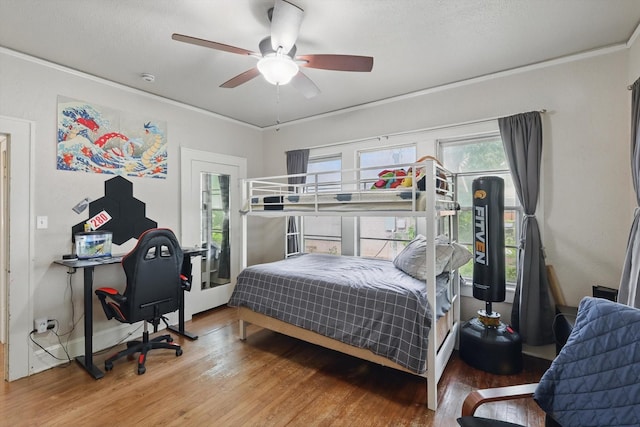 1425 W Gambrell St, Fort Worth, TX 76115 - bedroom with wood finished floors, an office area, a ceiling fan, and crown molding