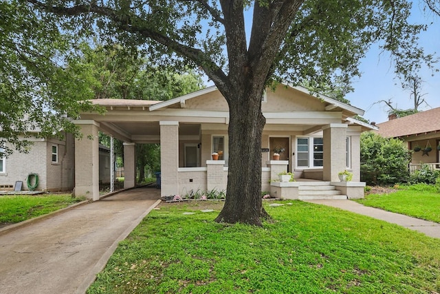 1425 W Gambrell St, Fort Worth, TX 76115 - view of front of property featuring brick siding, concrete driveway, a front yard, and an attached carport