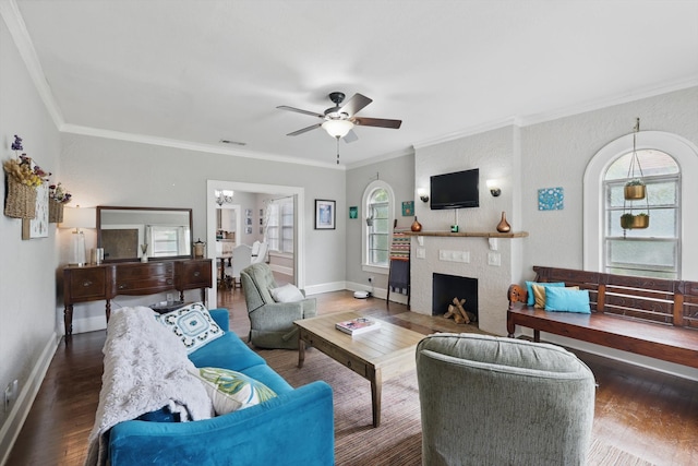 1425 W Gambrell St, Fort Worth, TX 76115 - living room with wood finished floors, ornamental molding, healthy amount of natural light, ceiling fan, and a fireplace