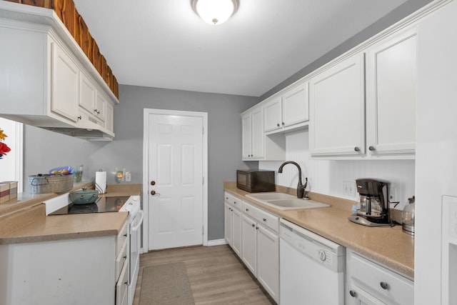 704 Windy Hl, Celeste, TX 75423 - kitchen featuring white dishwasher, range, black microwave, a sink, and light wood-type flooring