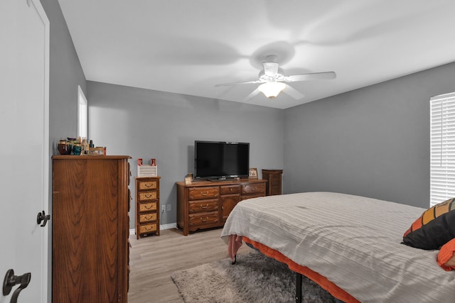 704 Windy Hl, Celeste, TX 75423 - bedroom with light wood-type flooring and ceiling fan