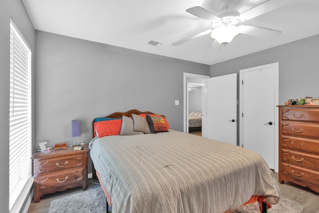 704 Windy Hl, Celeste, TX 75423 - bedroom with light wood-style flooring and a ceiling fan