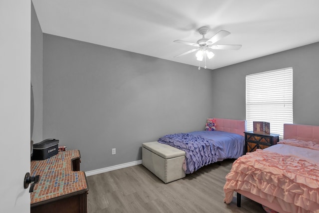 704 Windy Hl, Celeste, TX 75423 - bedroom featuring wood finished floors, baseboards, and ceiling fan