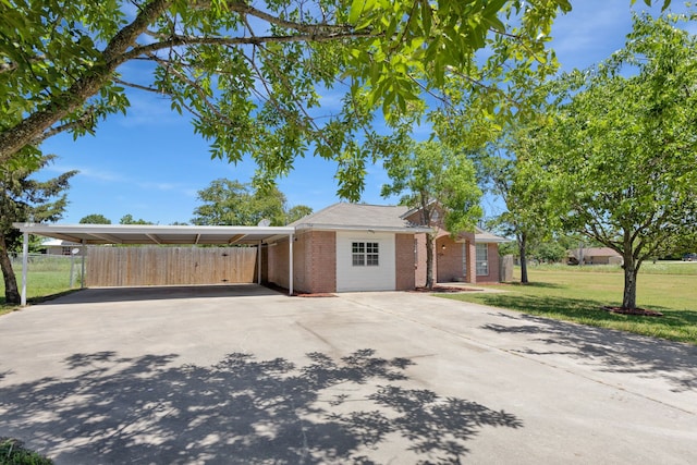 704 Windy Hl, Celeste, TX 75423 - view of front of home featuring driveway, brick siding, and an attached carport