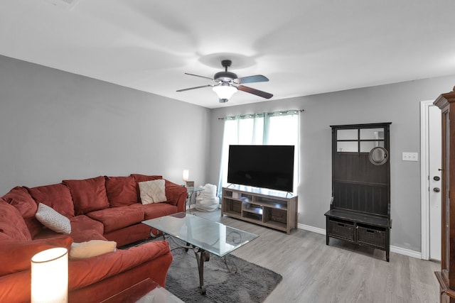 704 Windy Hl, Celeste, TX 75423 - living area featuring wood finished floors, a ceiling fan, and baseboards