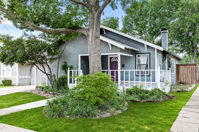 1800 Virginia Pl, Fort Worth, TX 76107 - view of front of house with covered porch, a chimney, stucco siding, and driveway