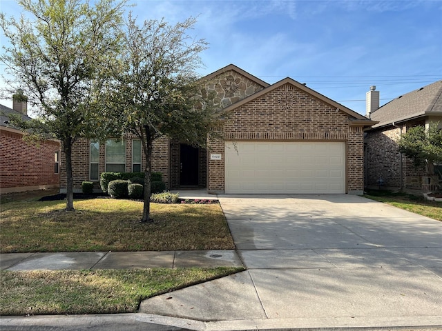 5420 Chinkapin Ln, Fort Worth, TX 76244 - view of front of house featuring a garage, concrete driveway, and brick siding