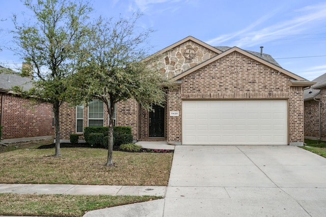 5420 Chinkapin Ln, Fort Worth, TX 76244 - view of front facade featuring an attached garage, concrete driveway, and brick siding