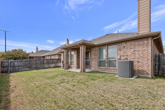 5420 Chinkapin Ln, Fort Worth, TX 76244 - rear view of house featuring a chimney, central air condition unit, brick siding, and a patio area