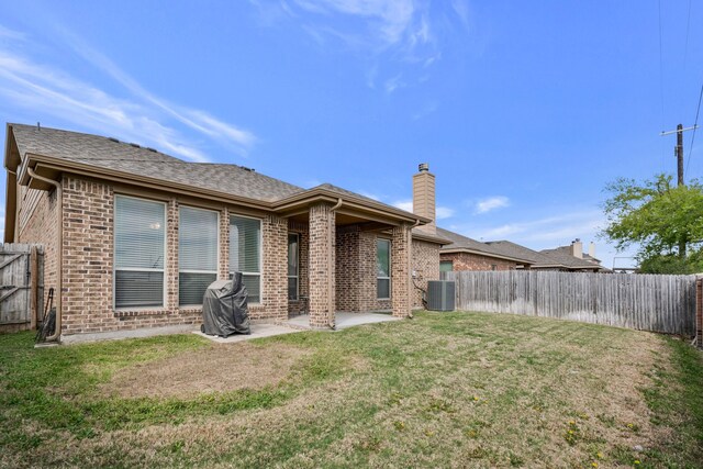 5420 Chinkapin Ln, Fort Worth, TX 76244 - rear view of property featuring central air condition unit, brick siding, a patio area, and a chimney