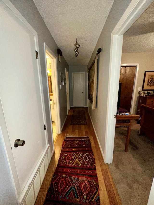 1002 Wrights W, Comanche, TX 76442 - hall featuring a textured ceiling
