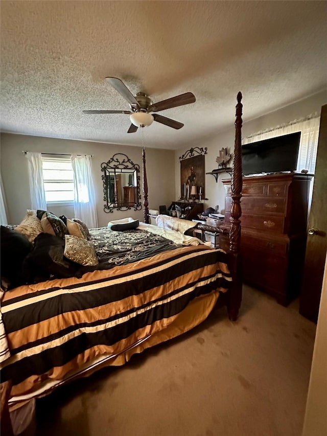 1002 Wrights W, Comanche, TX 76442 - bedroom with carpet floors, ceiling fan, and a textured ceiling