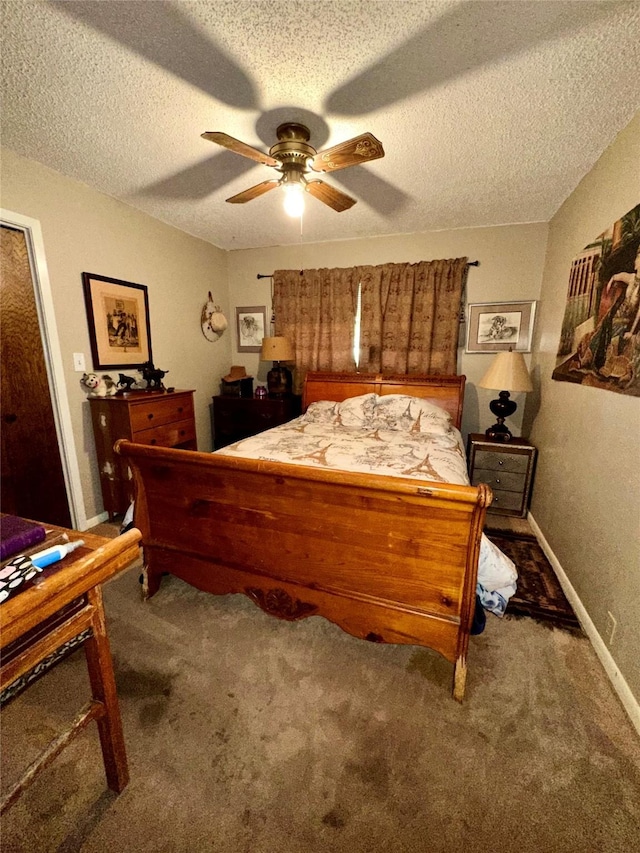 1002 Wrights W, Comanche, TX 76442 - carpeted bedroom featuring a textured ceiling, ceiling fan, and baseboards