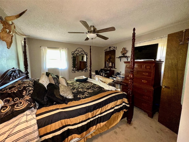 1002 Wrights W, Comanche, TX 76442 - carpeted bedroom with a textured ceiling and a ceiling fan