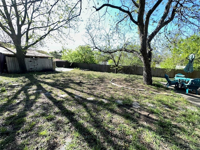 1002 Wrights W, Comanche, TX 76442 - fenced backyard with an outbuilding