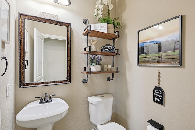 9117 Conroe Dr, Denton, TX 76226 - bathroom with toilet and a sink