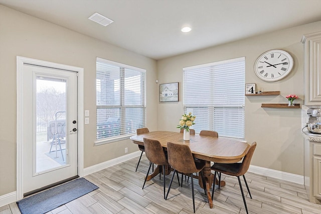 9117 Conroe Dr, Denton, TX 76226 - dining room with baseboards, wood tiled floors, and recessed lighting
