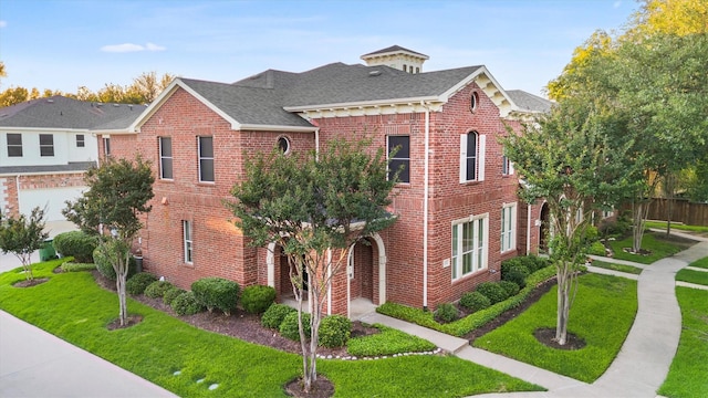 152 Leonard St, Lewisville, TX 75057 - view of front of home with a front lawn, roof with shingles, and brick siding