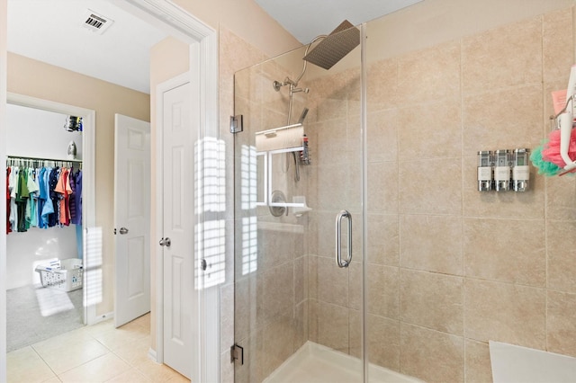152 Leonard St, Lewisville, TX 75057 - bathroom with a stall shower, tile patterned floors, and a walk in closet