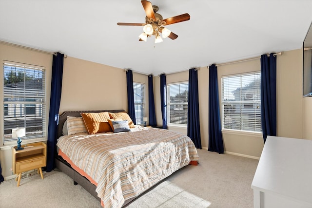 152 Leonard St, Lewisville, TX 75057 - carpeted bedroom with baseboards and a ceiling fan
