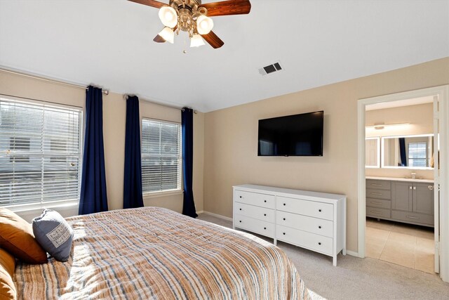 152 Leonard St, Lewisville, TX 75057 - bedroom with light colored carpet, baseboards, connected bathroom, vaulted ceiling, and a ceiling fan