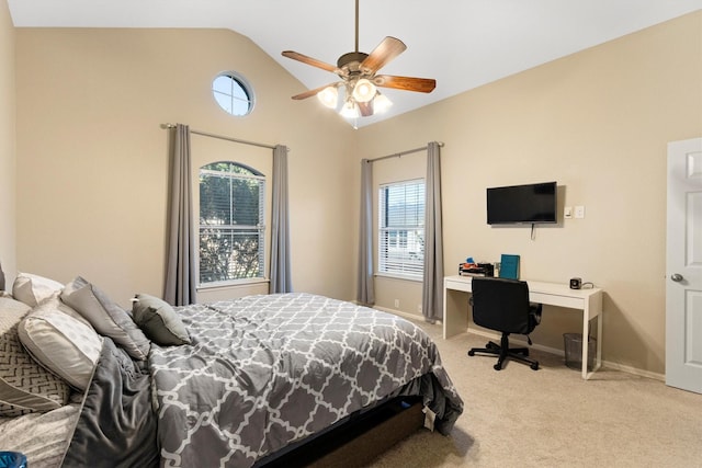 152 Leonard St, Lewisville, TX 75057 - bedroom with light carpet, multiple windows, vaulted ceiling, baseboards, and a desk