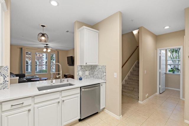 152 Leonard St, Lewisville, TX 75057 - kitchen featuring dishwasher, a sink, ceiling fan, light countertops, and white cabinets