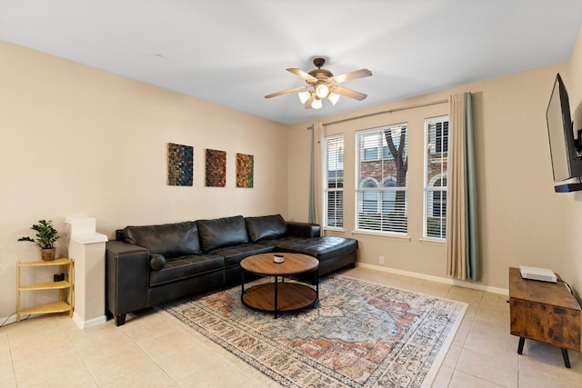 152 Leonard St, Lewisville, TX 75057 - living area featuring light tile patterned floors, a ceiling fan, and baseboards