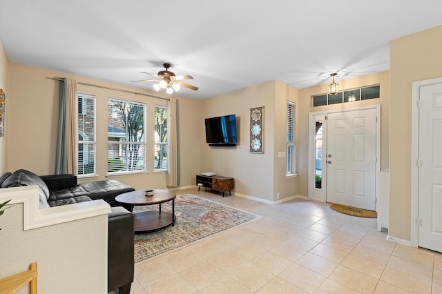 152 Leonard St, Lewisville, TX 75057 - living area featuring ceiling fan, light tile patterned floors, and baseboards