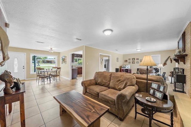 3917 N 31st St, Waco, TX 76708 - living area featuring light tile patterned flooring and baseboards