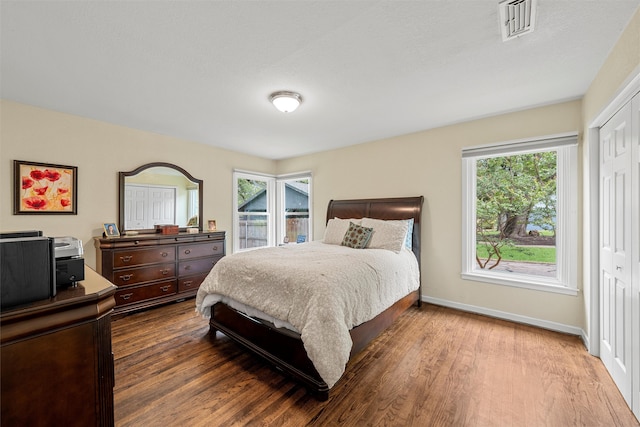 3917 N 31st St, Waco, TX 76708 - bedroom with wood finished floors, baseboards, and a closet