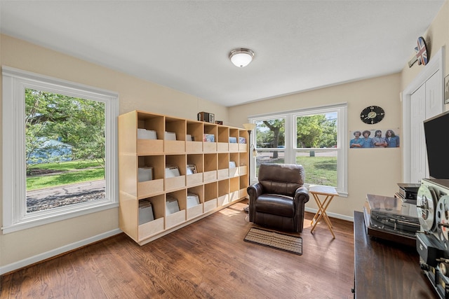 3917 N 31st St, Waco, TX 76708 - living area with baseboards, healthy amount of natural light, and wood finished floors